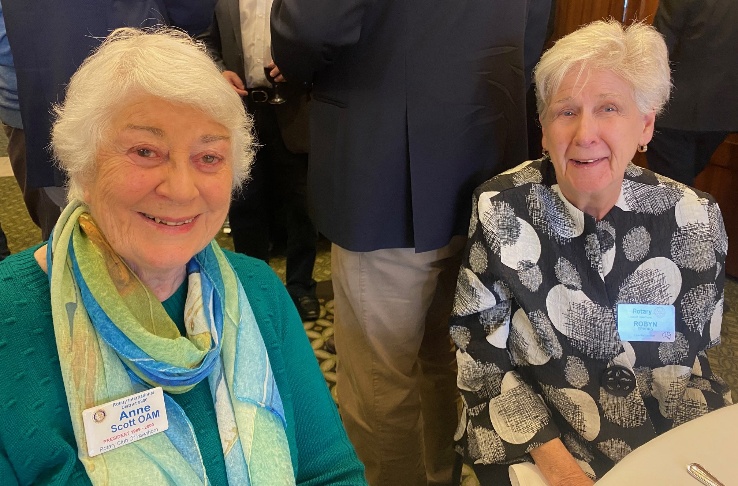 Two women smiling at the cameraAI-generated content may be incorrect.