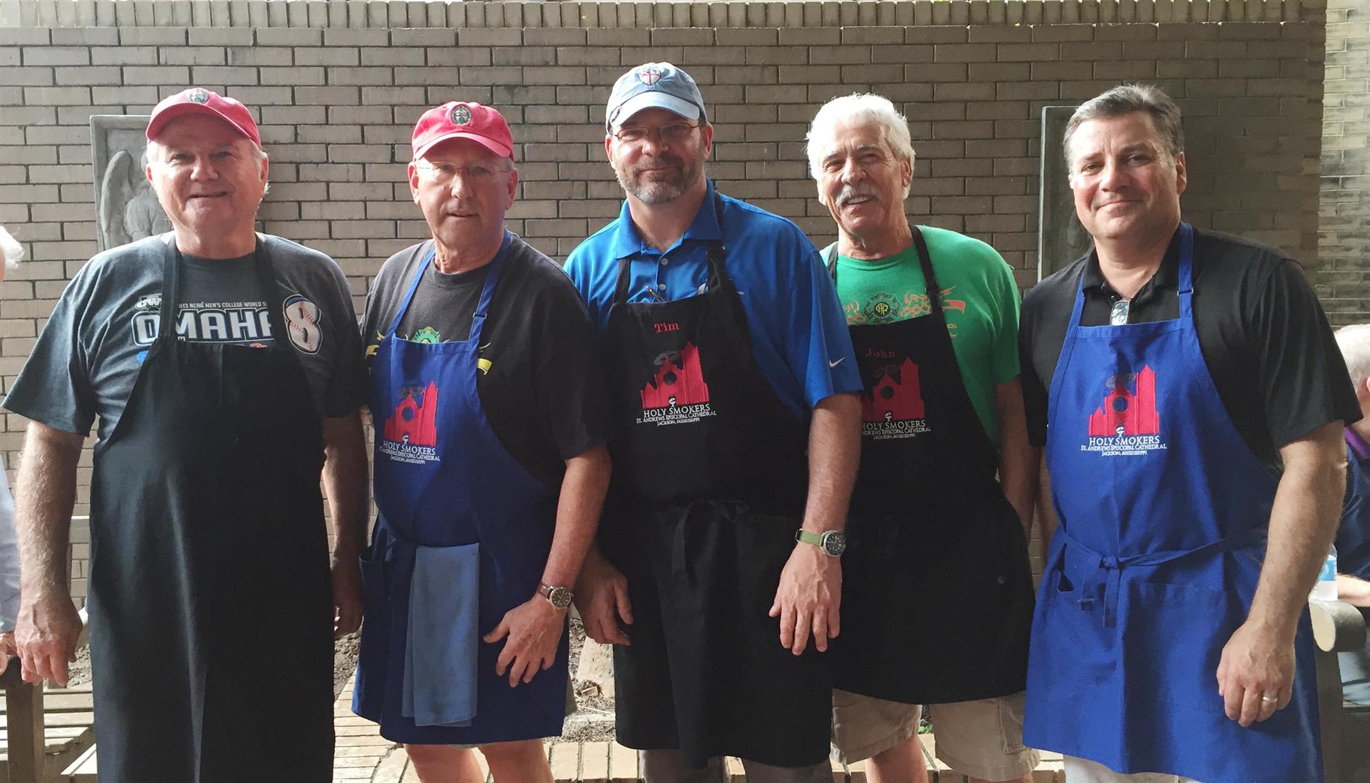 Members of the St. Andrews Holy Smokers cooking team.