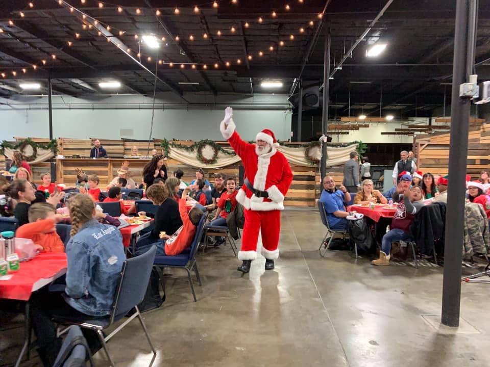 Santa arrives at our holiday party for special needs students