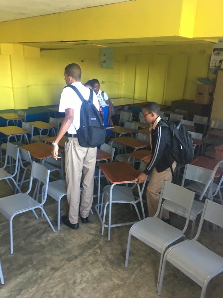 Donating desk and chairs to schools children Rotary Club of Ocho Rios