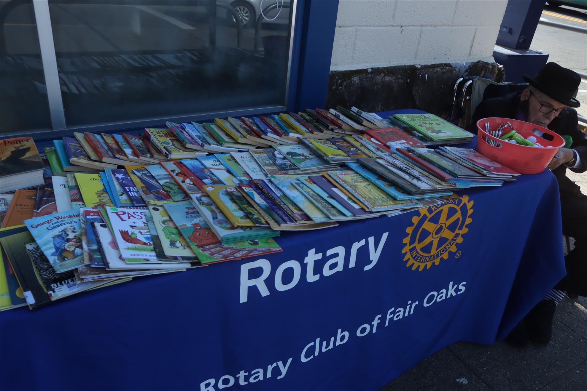 Rotarians Hand Out Books to Children at Safer Halloween