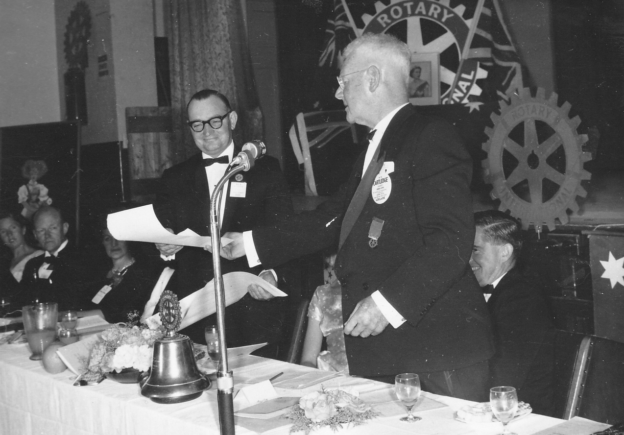 President Rex Andrew receiving the Charter from District Governor Harry Cartledge