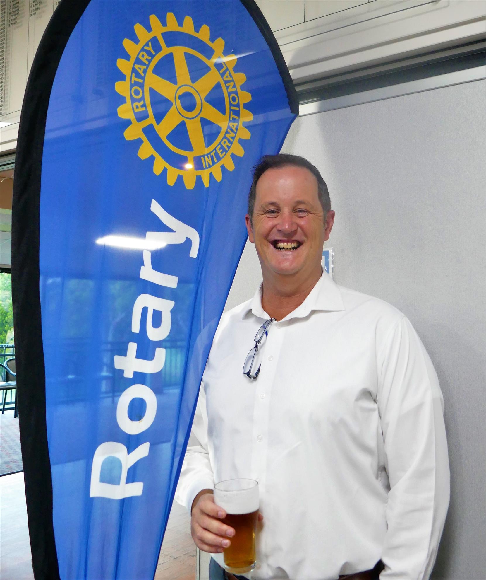 May be an image of one or more people, people standing and text that says "Caloundra Club Rotary AN Pacific of INDUCTION 대 Higgs Peter Rotary Opens sOpportunities Induction President Sreig"