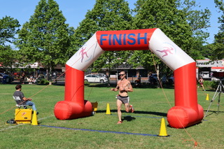 136A0691.JPG Third runner Crossing finish line, 1st Female Runner
