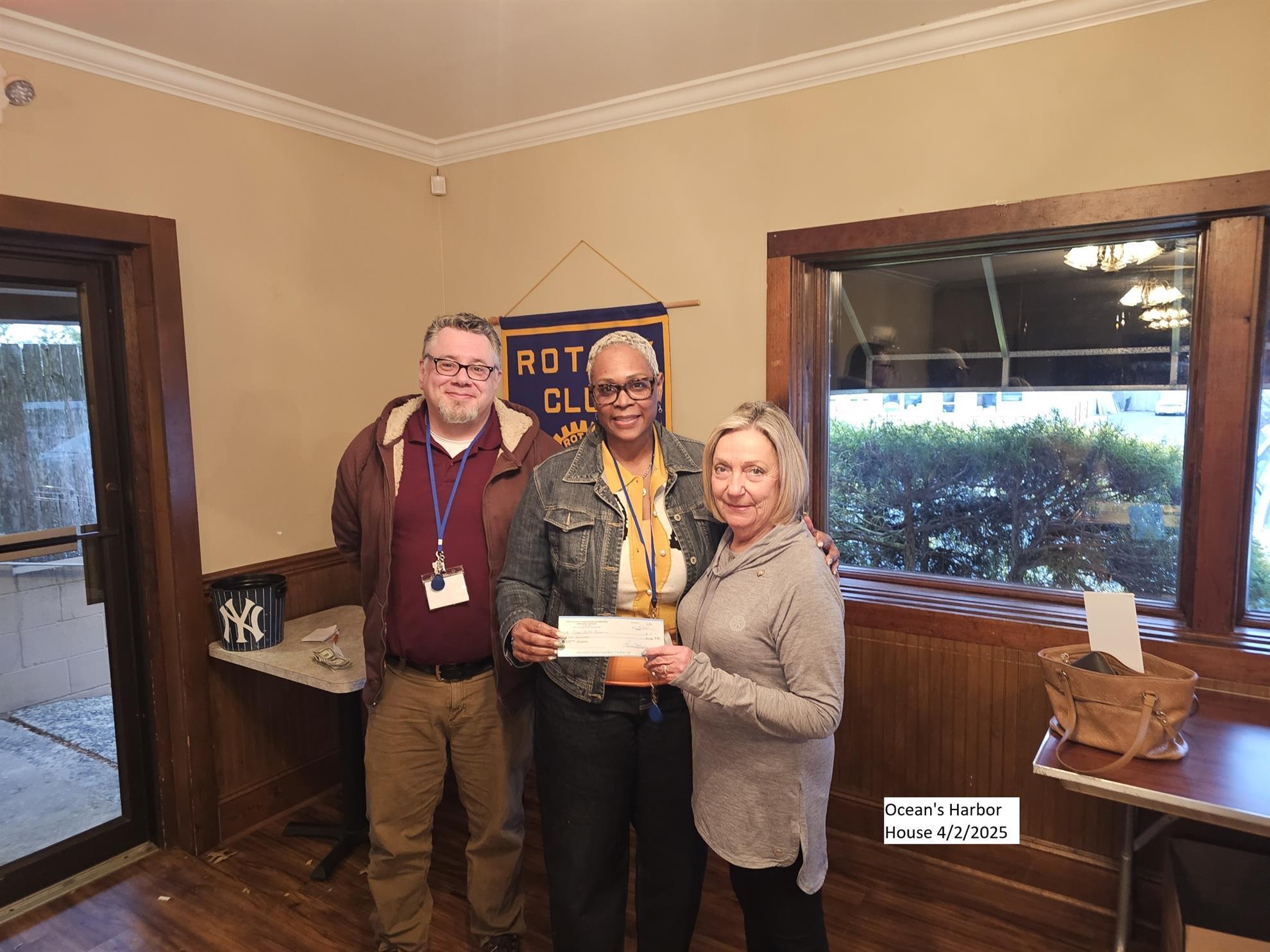 Our club making a donation to Ocean's Harbor House