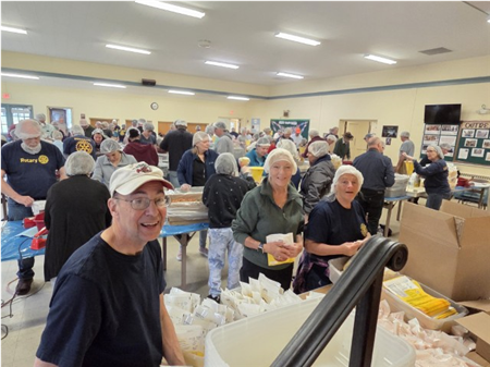 Rotarians Support DG Stephanie's Food Packing Event 