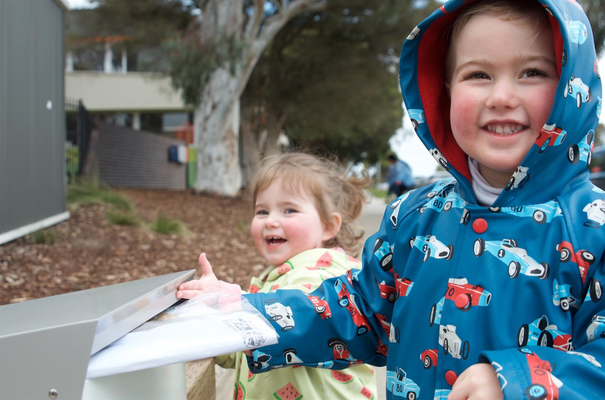 Siblings-Receiving-their-books-in-the-mail_UWA.jpg