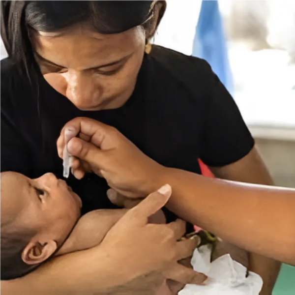 Mother and baby receiving vaccine