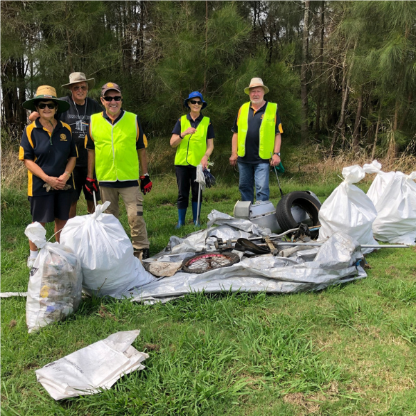 Group of people with collected rubbish