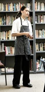 A person sitting at a pianoAI-generated content may be incorrect.