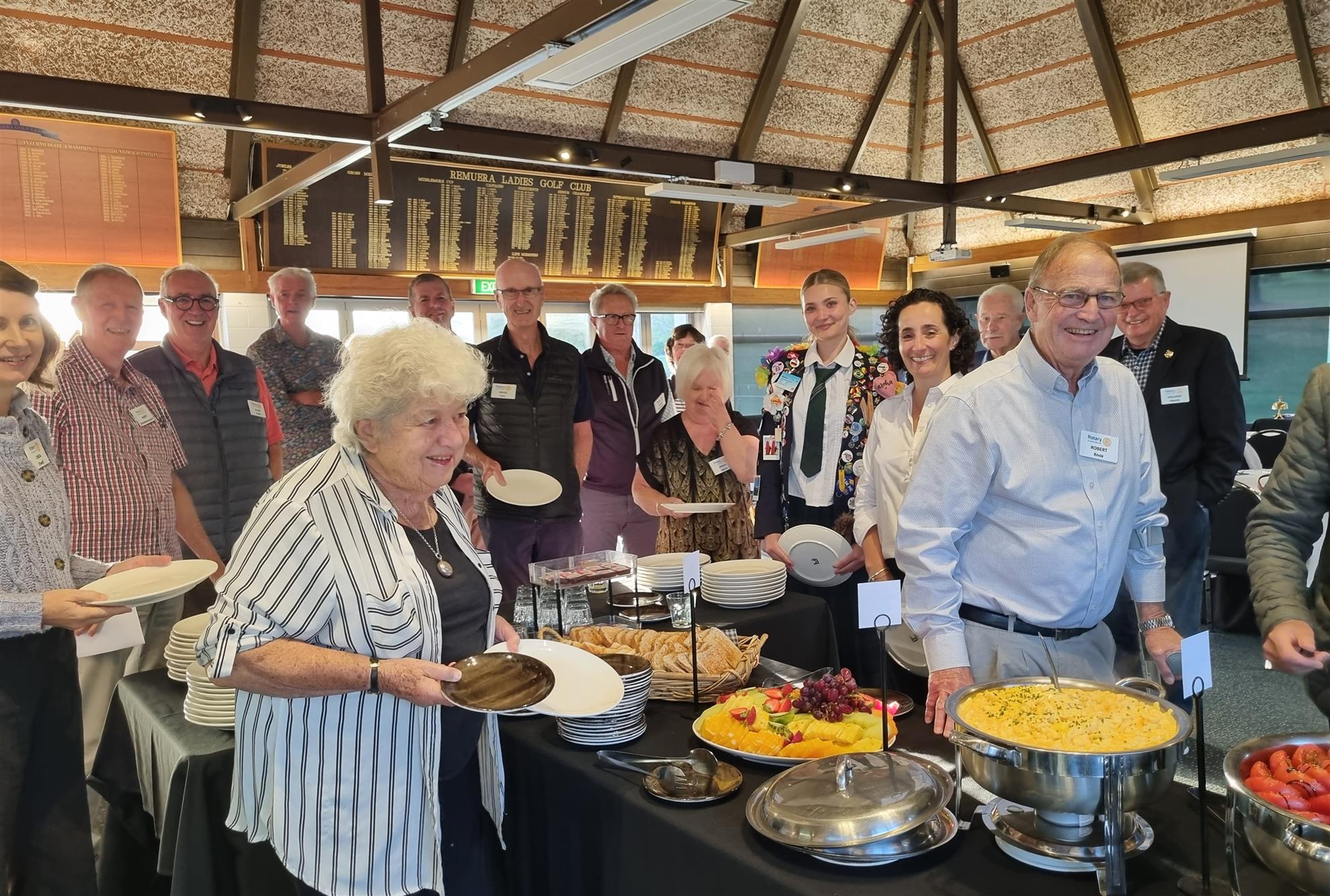 Club members serving breakfast at a Thursday morning meeting