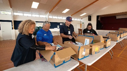 Food hampers being prepared by Sergeant Rhys Smith and volunteers.