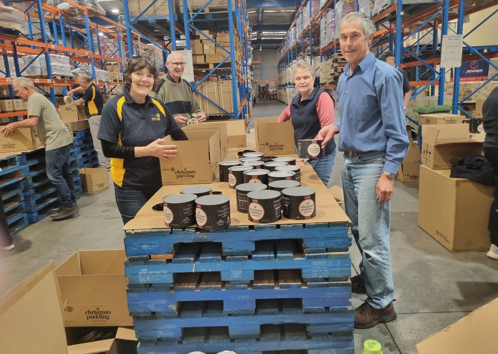 St Johns Ellerslie Rotary members packing Christmas puddings