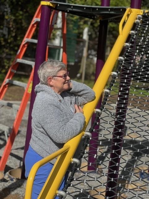 Karen Emerson beside the climbing net.