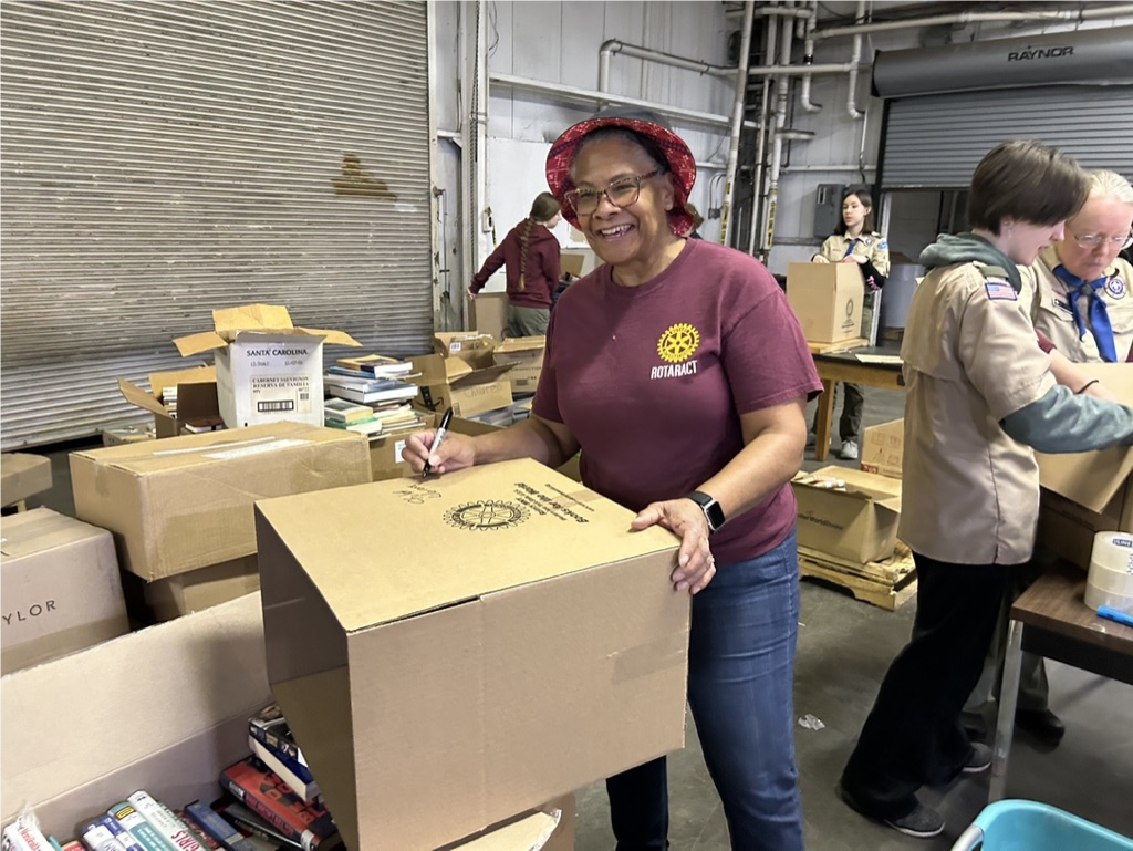 Immediate past-president, Lisa Norwood, labels a box