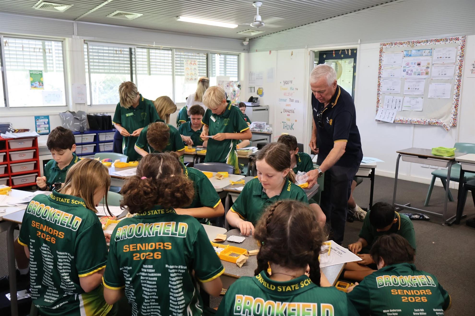 Helping Students assemble Solar Lights