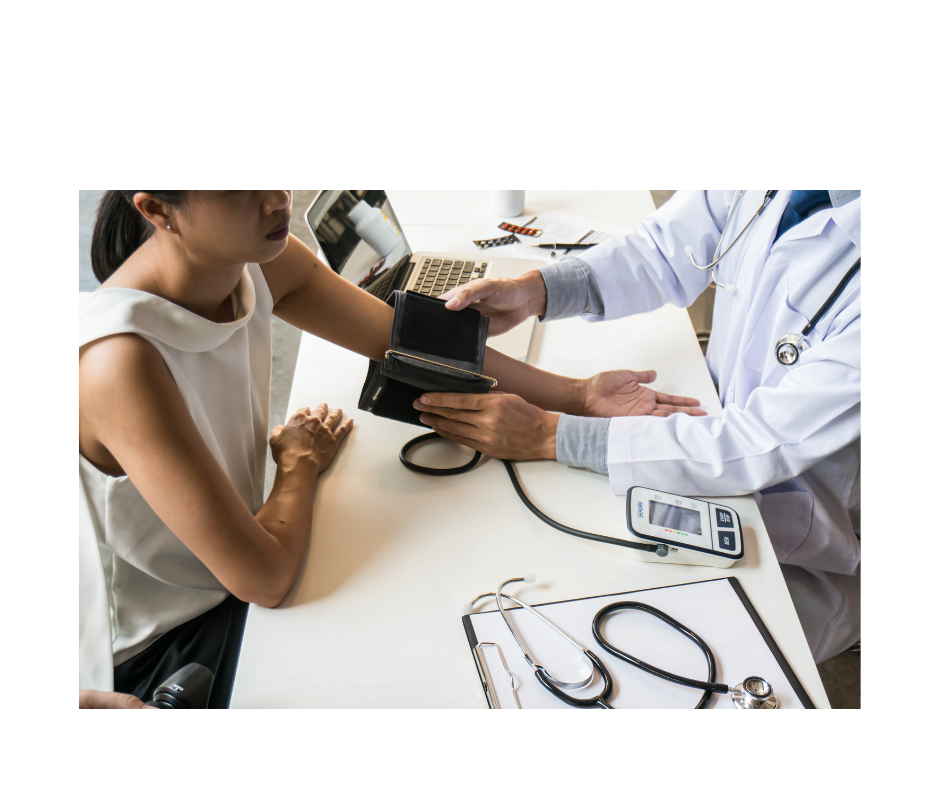 Doctor checking a patient's blood pressure during a consultation