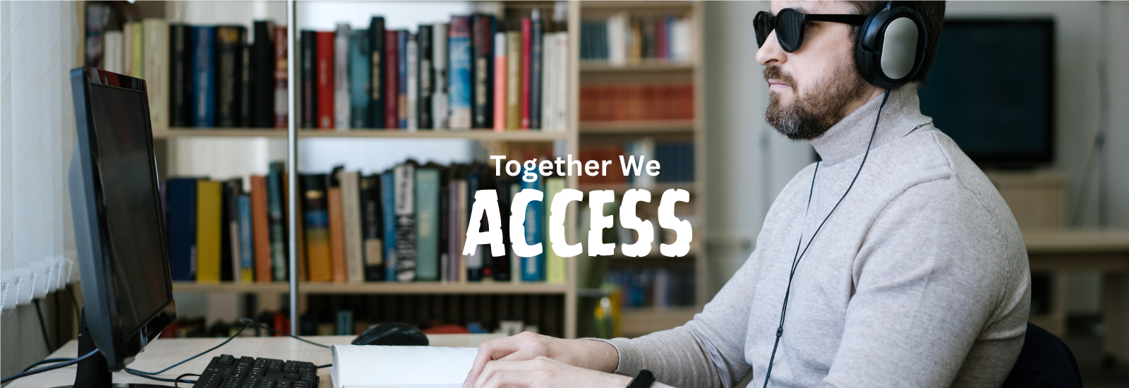 Blind man using a computer with headphones and a screen reader. “Together, We Access.”
