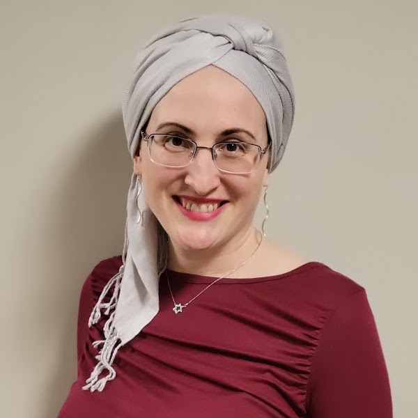 Portrait of Rotarian Amy Bodkin, Chair of the Inclusive Education Initiative, smiling at the camera.