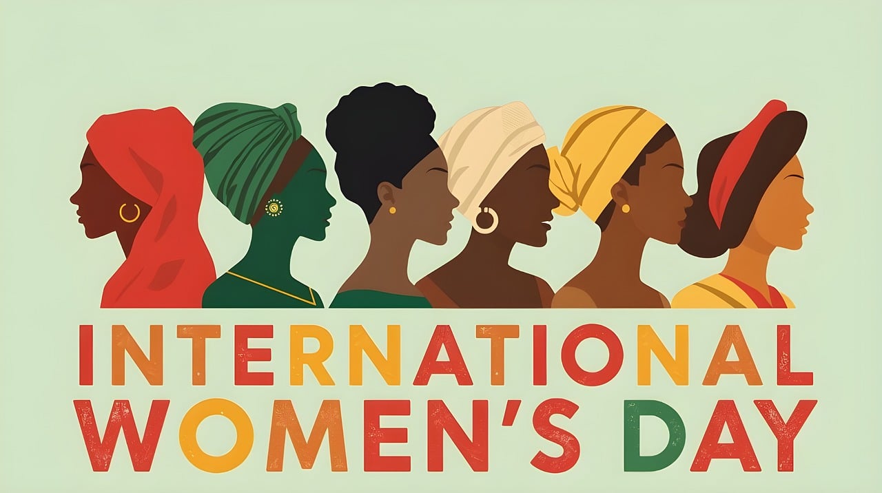 Illustration of diverse women in profile wearing colorful head coverings above the words International Women's Day, symbolizing diversity, strength, and global solidarity among women.