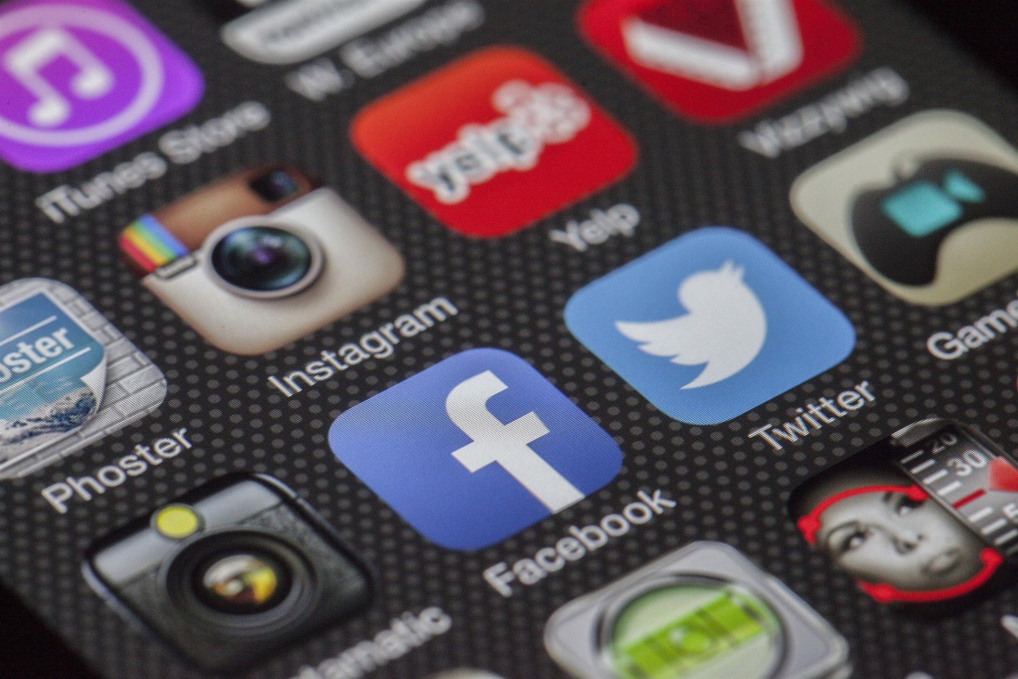 Close-up of social media and communication app icons on a smartphone screen.