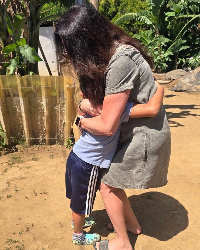 Claire Date with the little boy whose family will move into one of the new homes in November.