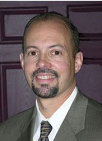 A person in a suit and tieAI-generated content may be incorrect.