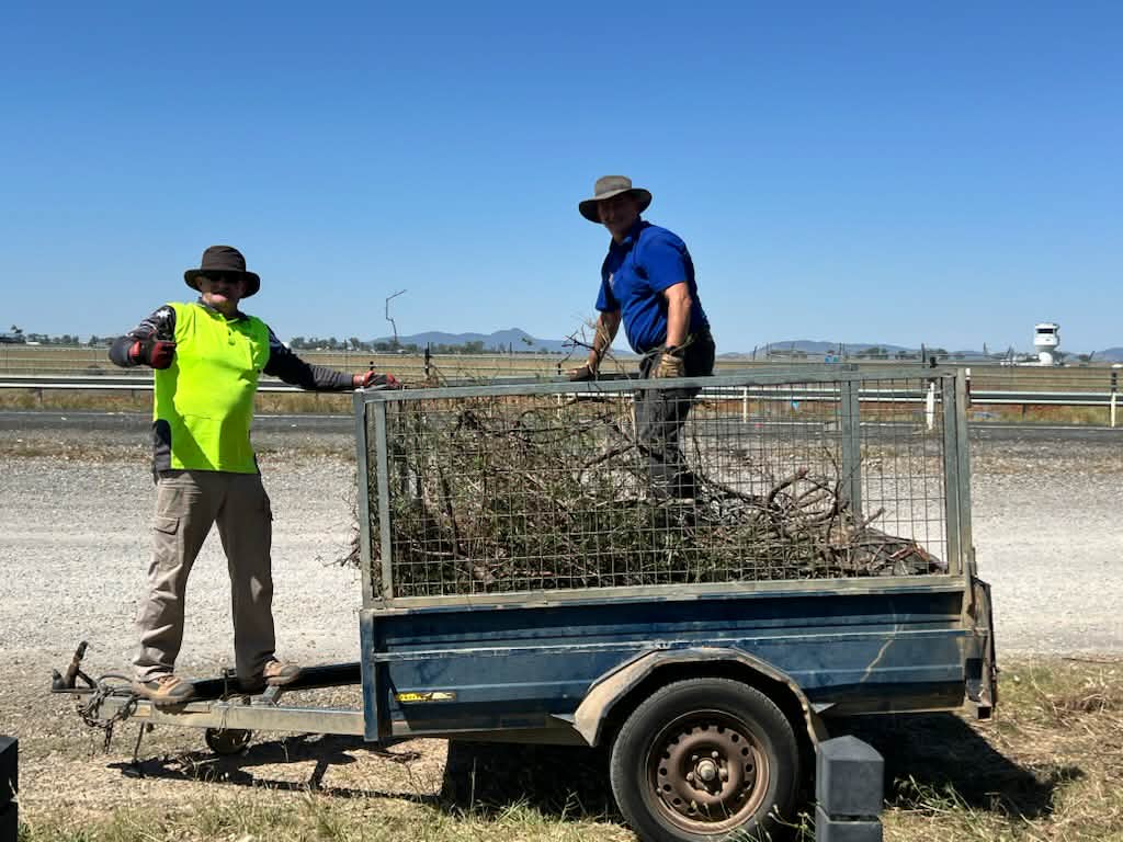 Scott Edwards undertaking the counter balance for the trailer while James Hindmarsh treads down the waste to fit more in.