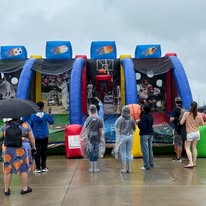 Families enjoying the inflatable attractions at Patch at the Park 2026