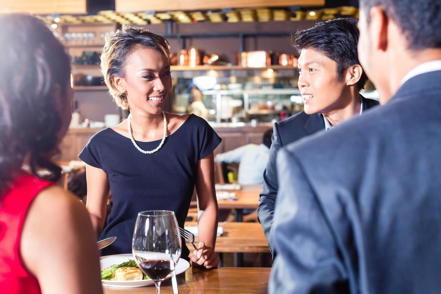 Business professional networking over dinner