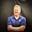 photo of Karl Mecklenburg in a blue Denver Broncos shirt standing in front of a gray background