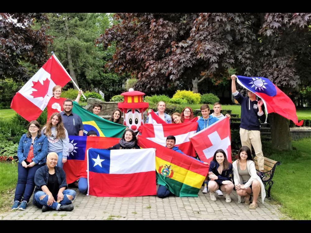Photo of exchange students with flags