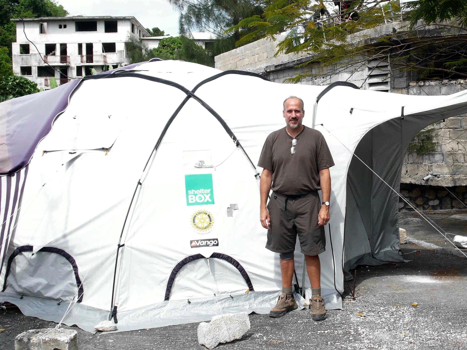 Concord Rotarian Paul D’Oliveira with a Rotary-sponsored ShelterBox tent after an earthquake in Haiti. 