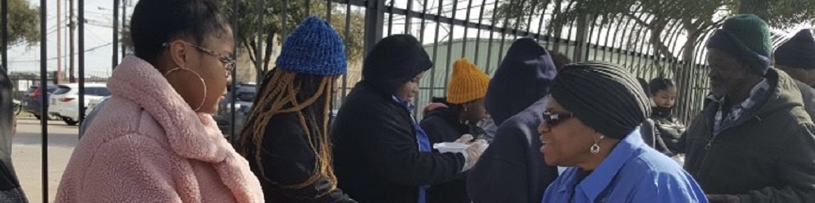 Handing out food to the homeless with Altrusans and First CME Baptist Church.