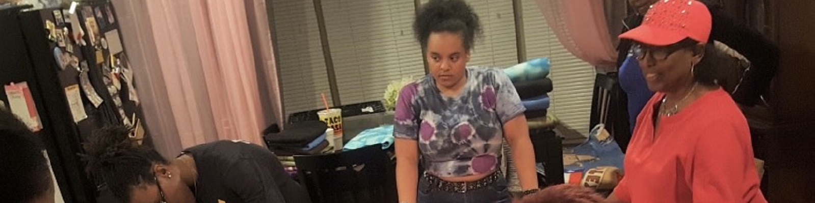 Astra club helping Altrusa Southwest Dallas County make lap blankets and scarves for the homeless.