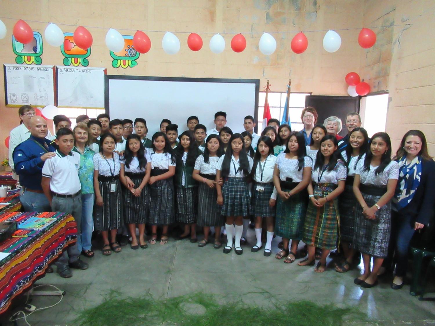Ripple Effect scholarship students with Rotarians at a celebration ceremony