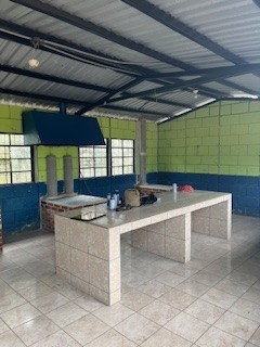The newly renovated school kitchen with clean counters and proper ventilation