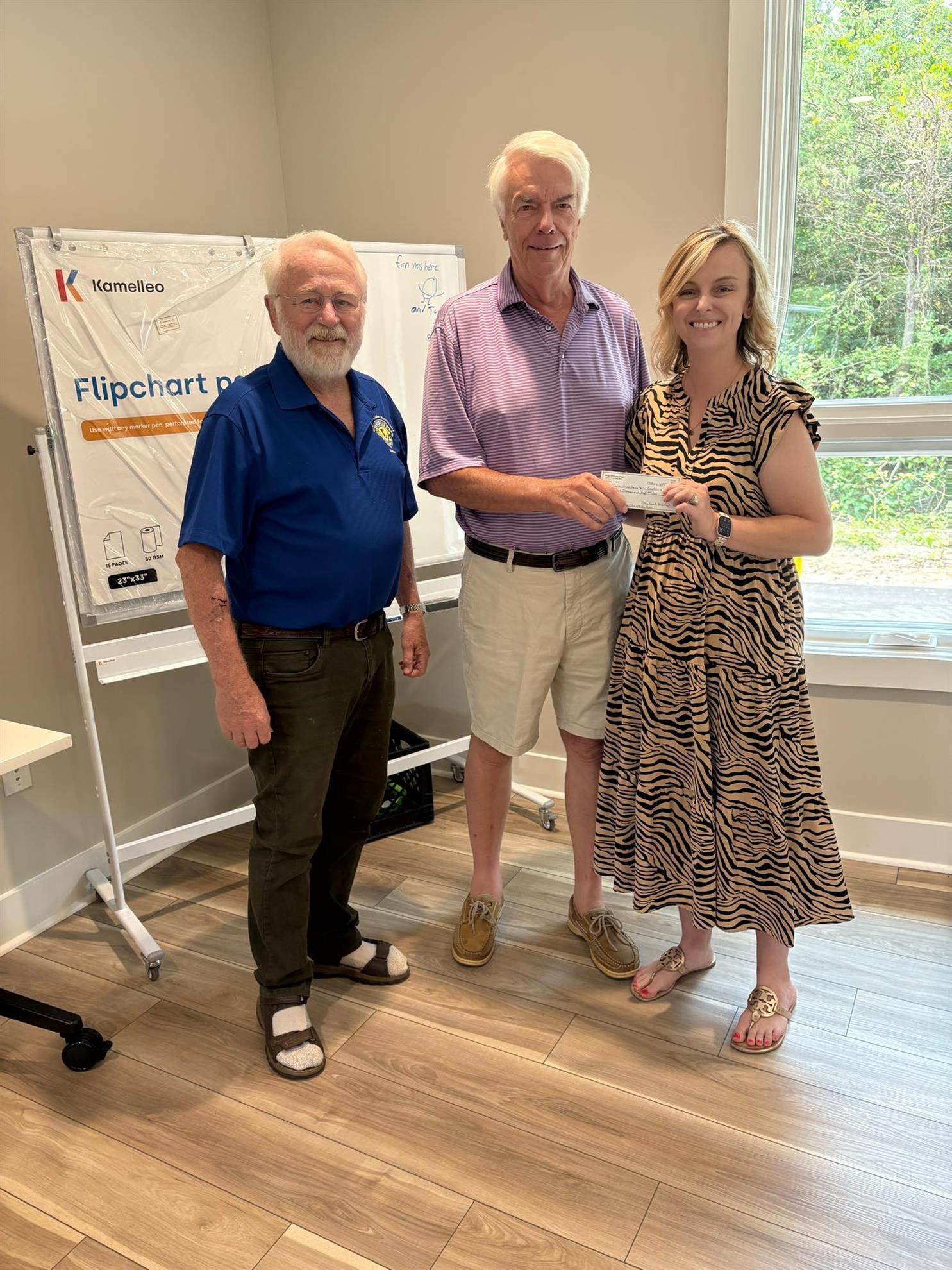 Larry Arnold and Jerry Epping, Lions members and Cameron Hurst the Executive Director of the Clover Area Assistance Center are pictured