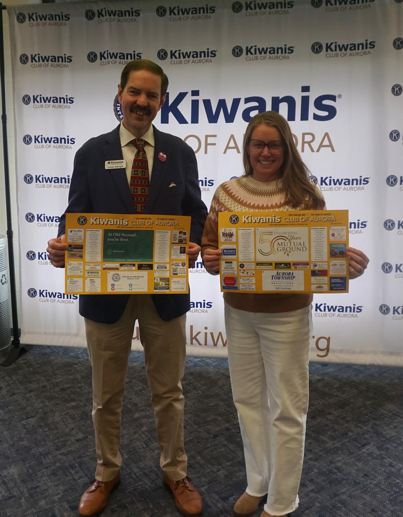 President Lucas Albright & Treasurer Kim Woodin display Pancake placemats