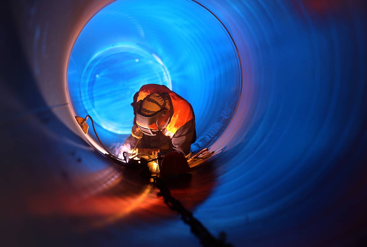 Pipeline worker operating inside of a pipeline.