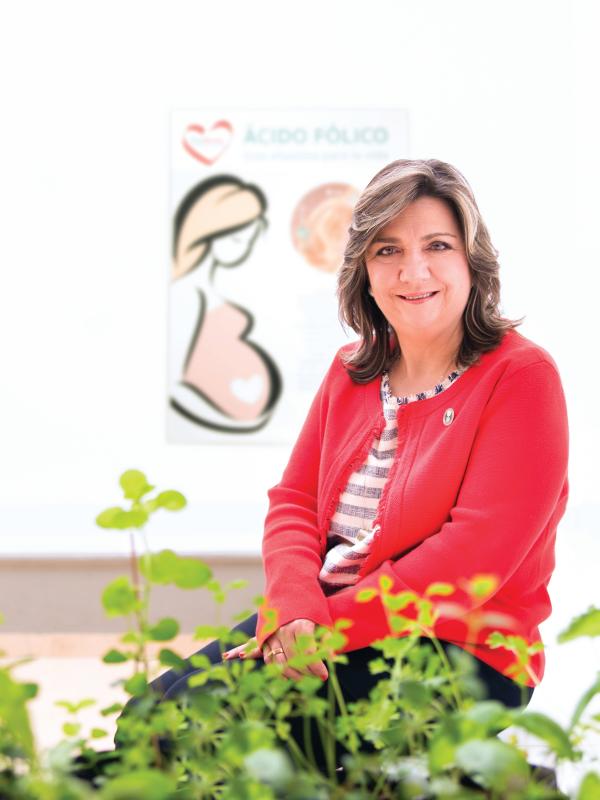 A person sitting in front of a plant
AI-generated content may be incorrect.