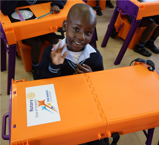 A child sitting at a desk
AI-generated content may be incorrect.