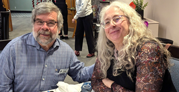 A person and person sitting at a tableDescription automatically generated