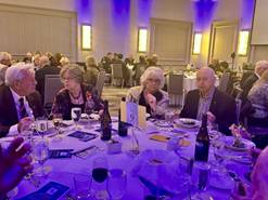 A group of people sitting at a tableDescription automatically generated